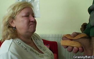 Busty granny tastes yummy cock